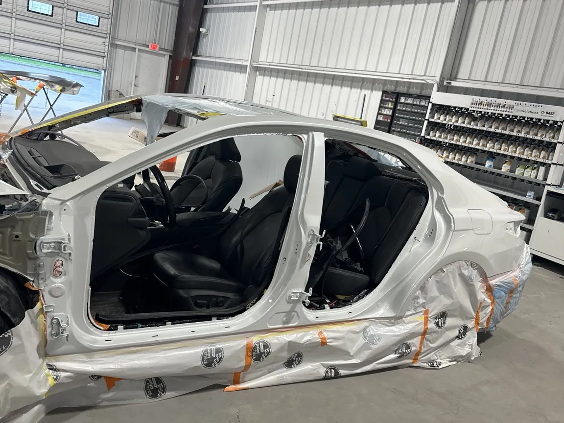 Body repair in progress on a disassembled vehicle at Prime CRS